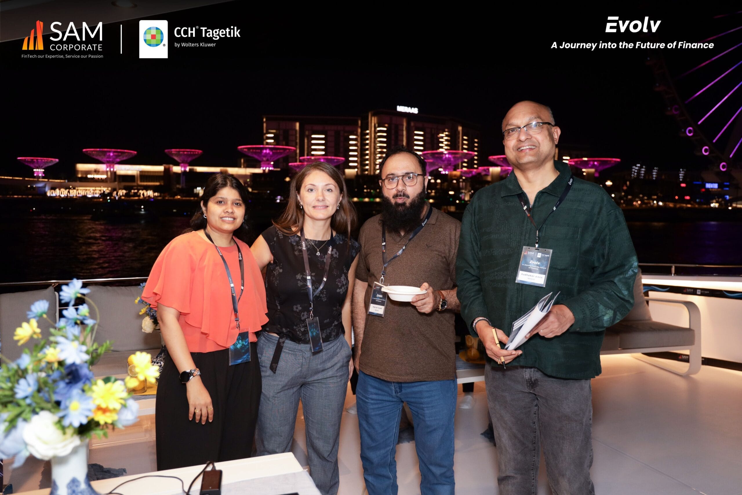 SAM Corporate and CCH Tagetik executives posing together on the yacht deck during the Evolv event.