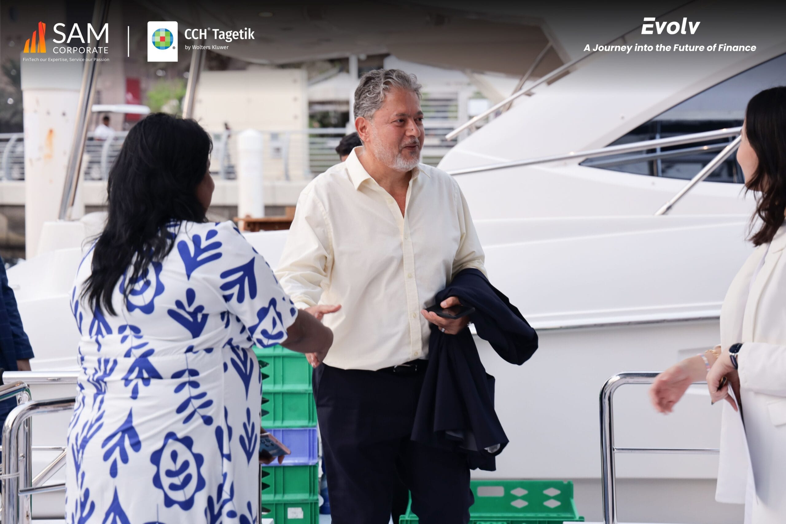SAM Corporate CCH Tagetik Evolv event attendees networking on the deck of a yacht.