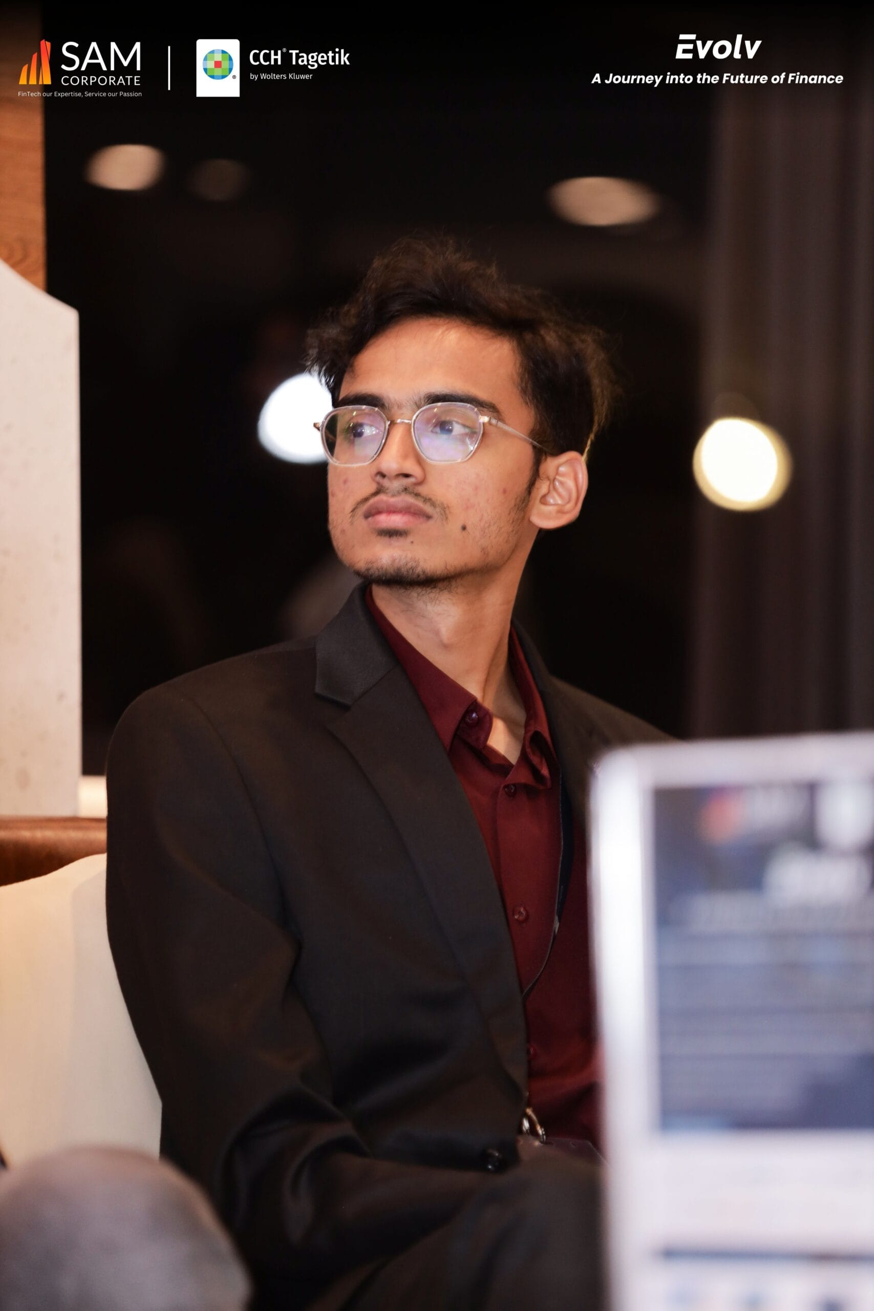 Evolv summit attendee by SAM Corporate and CCH Tagetik listening to a finance presentation.