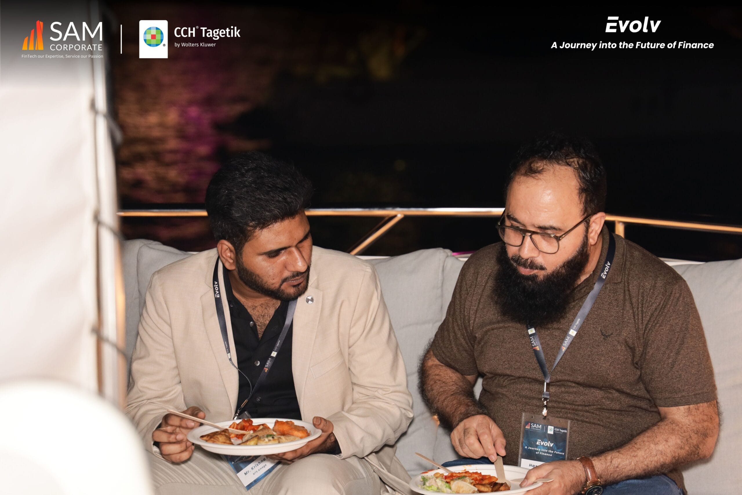 Two SAM Corporate and CCH Tagetik executives enjoy dinner while networking at the Evolv event.