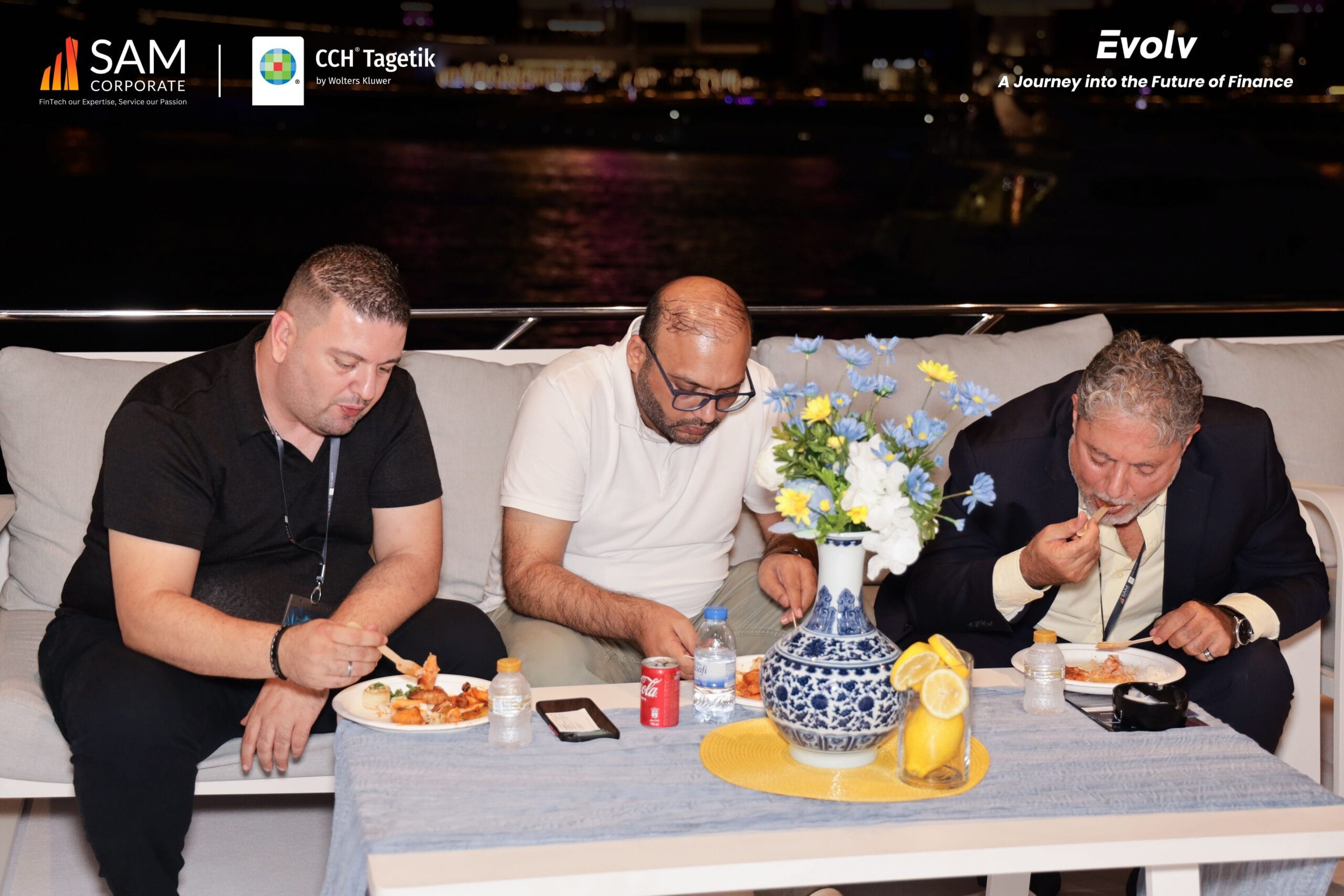 SAM Corporate and CCH Tagetik executives enjoy dinner while networking at the Evolv event.