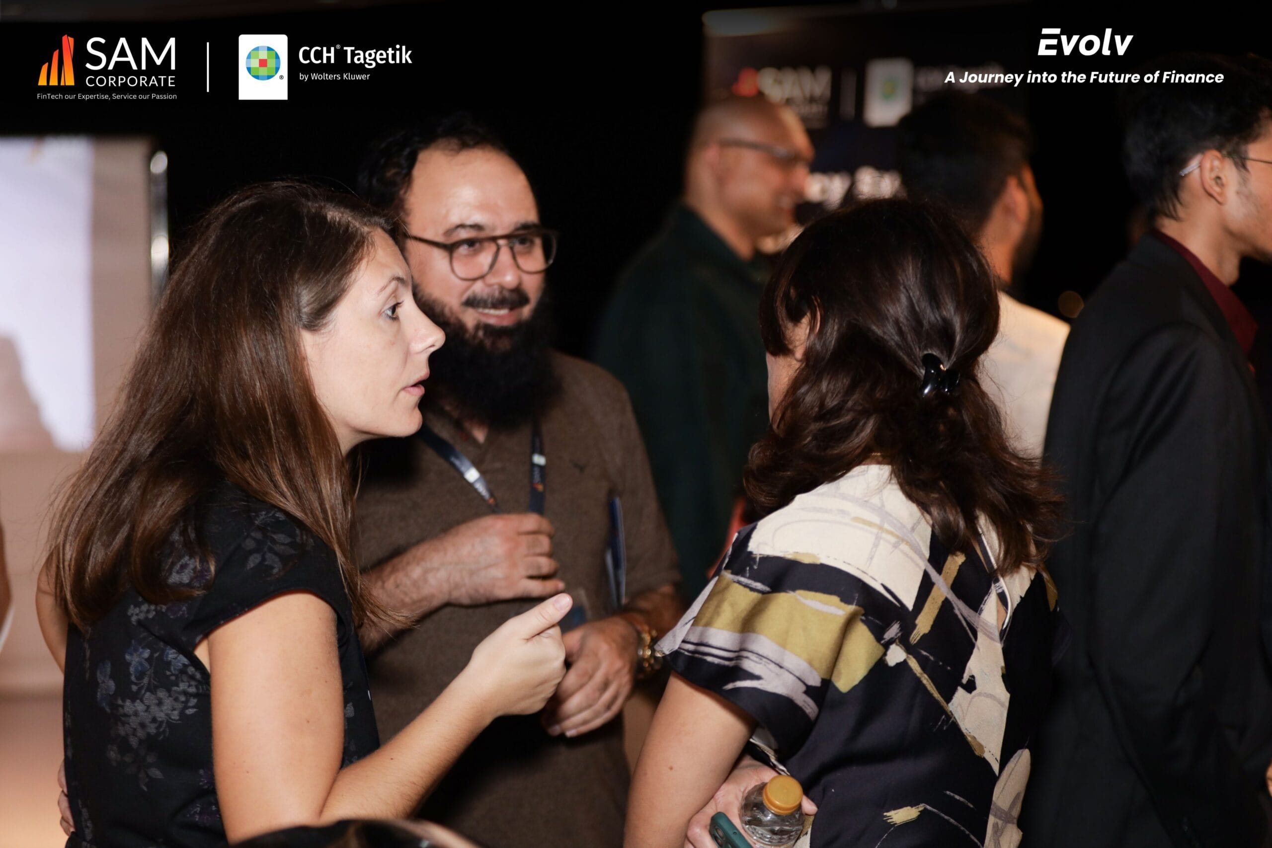 SAM Corporate and CCH Tagetik guests engaged in a close professional conversation at the Evolv networking event.