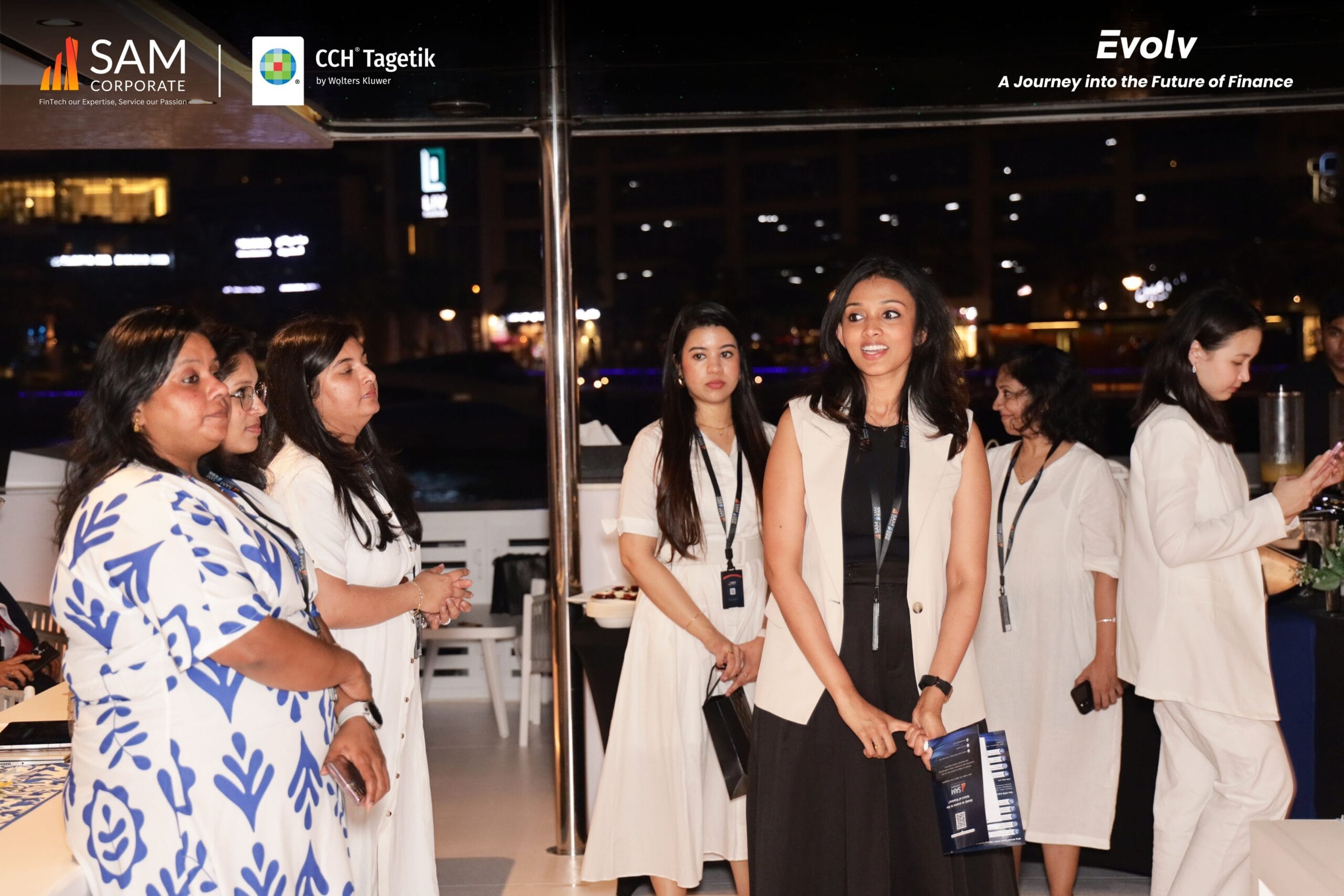 group of female executives from SAM Corporate and CCH Tagetik standing on the yacht deck during the Evolv event.