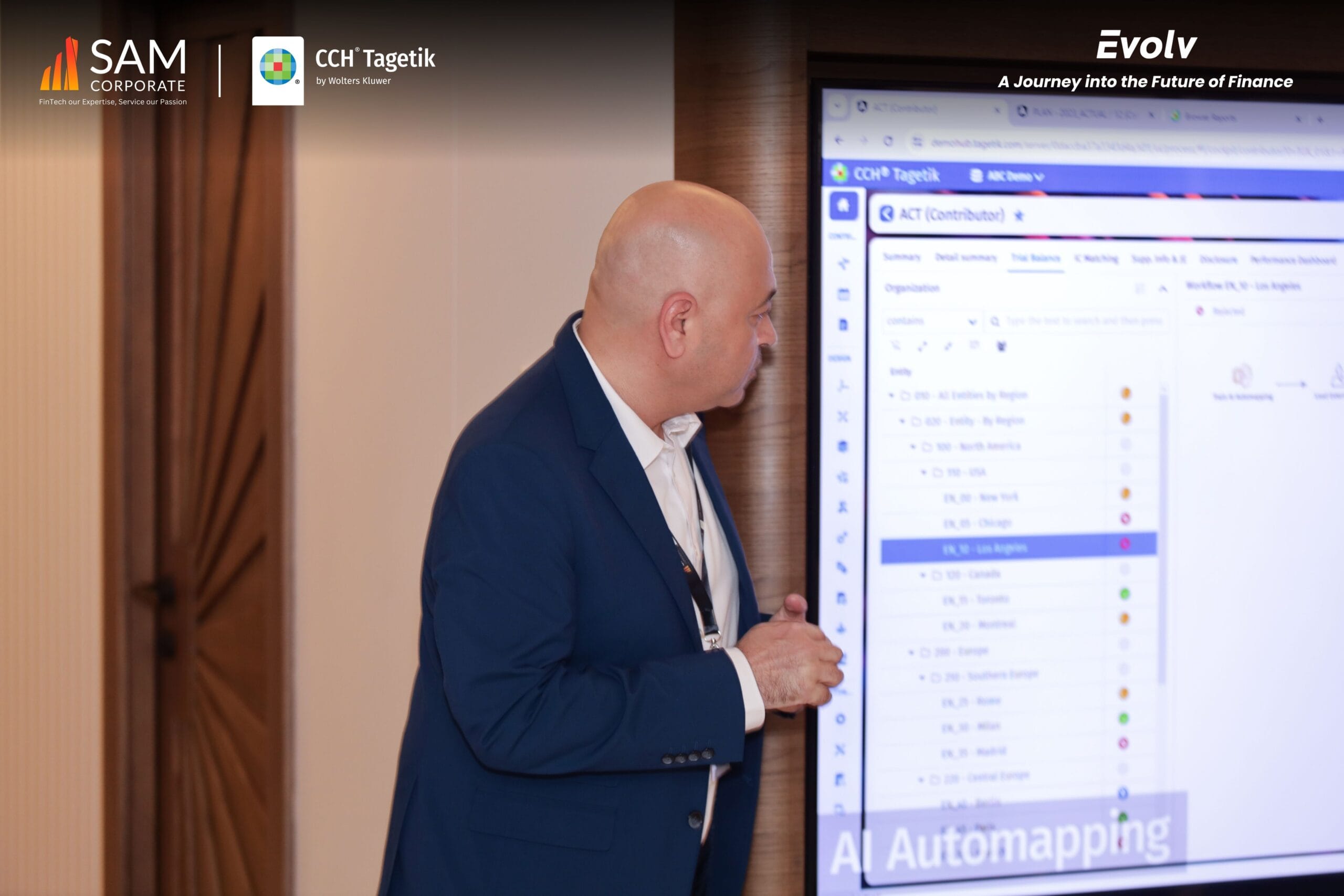 An executive presents a live demonstration of CCH Tagetik features at the Evolv finance technology event hosted by SAM Corporate.