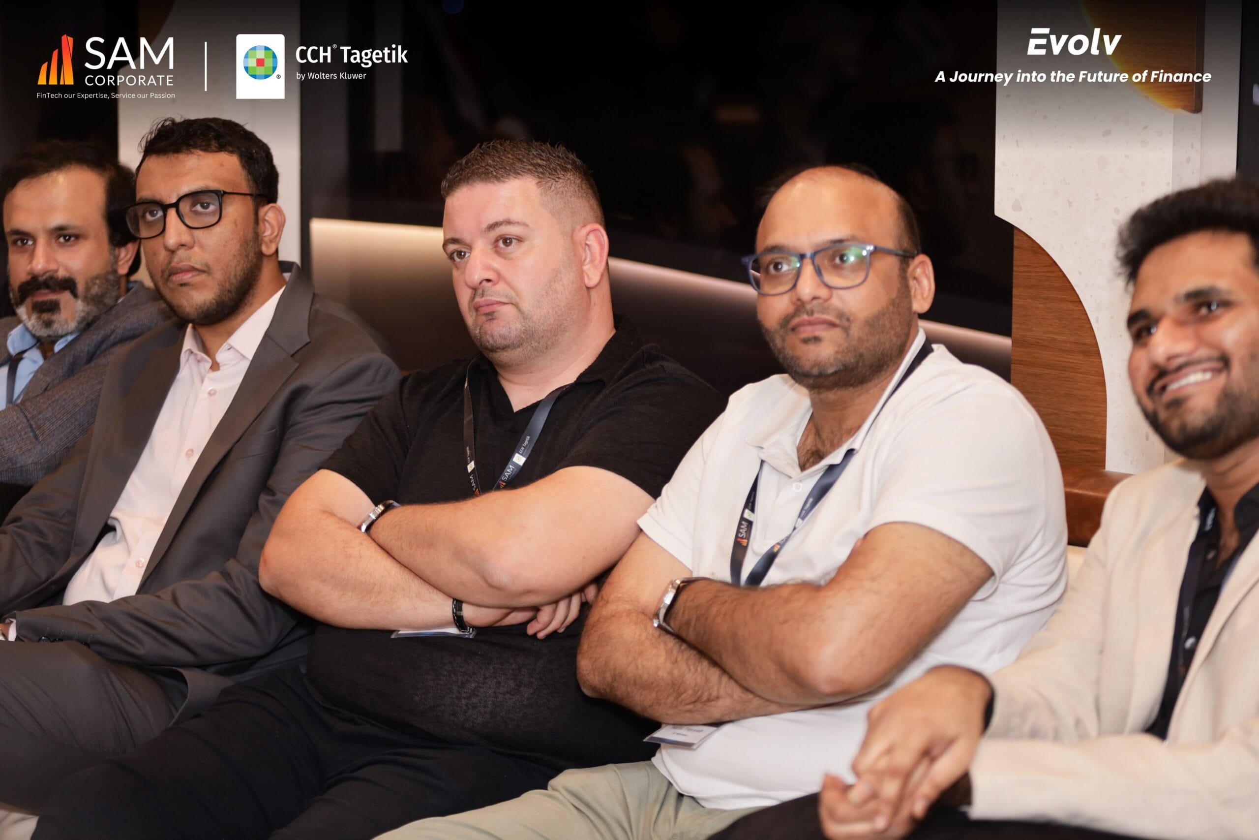 finance executives focused on the presentation at the Evolv summit by SAM Corporate and CCH Tagetik.
