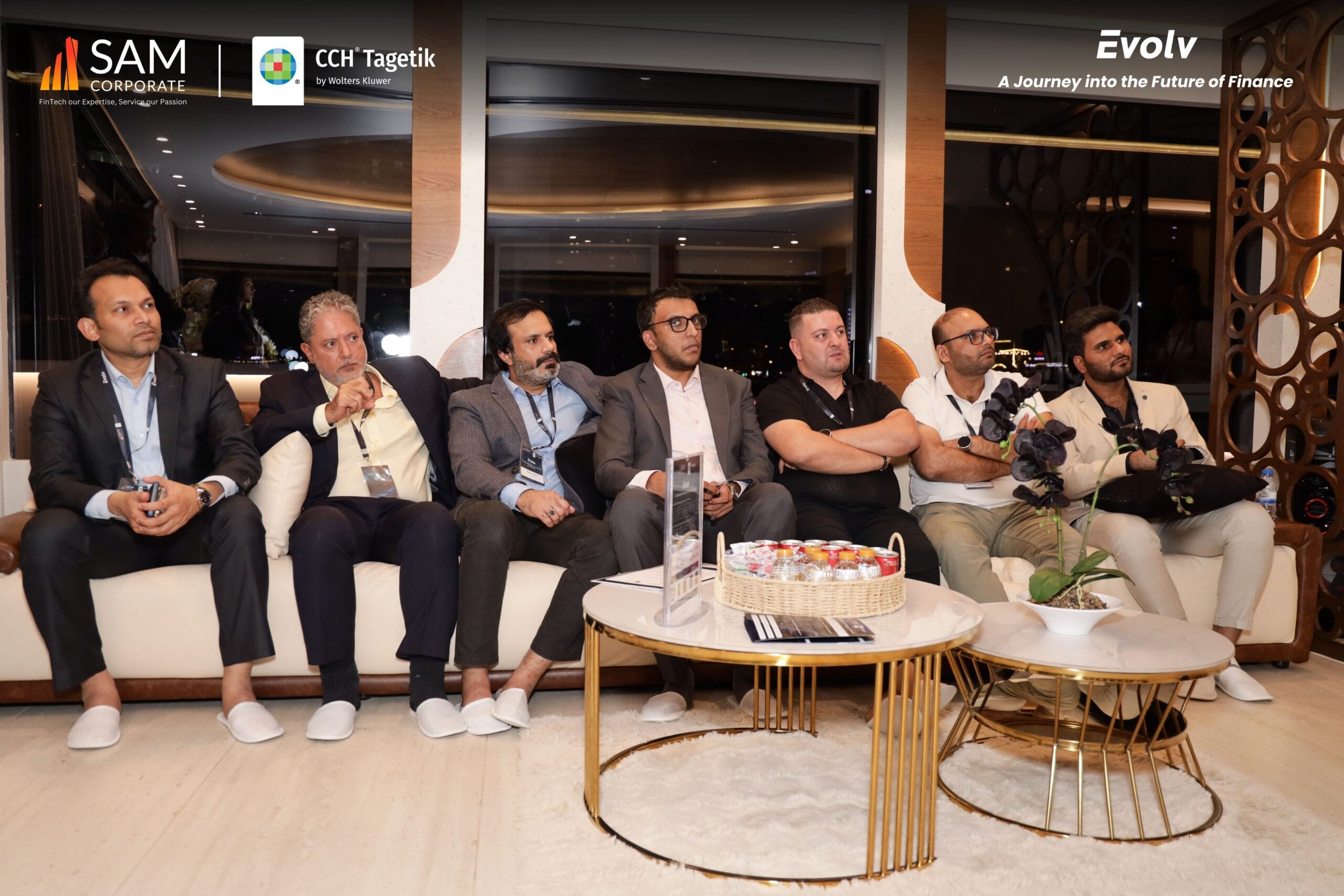 Group of male finance executives seated together during a networking session at the Evolv event by SAM Corporate and CCH Tagetik.