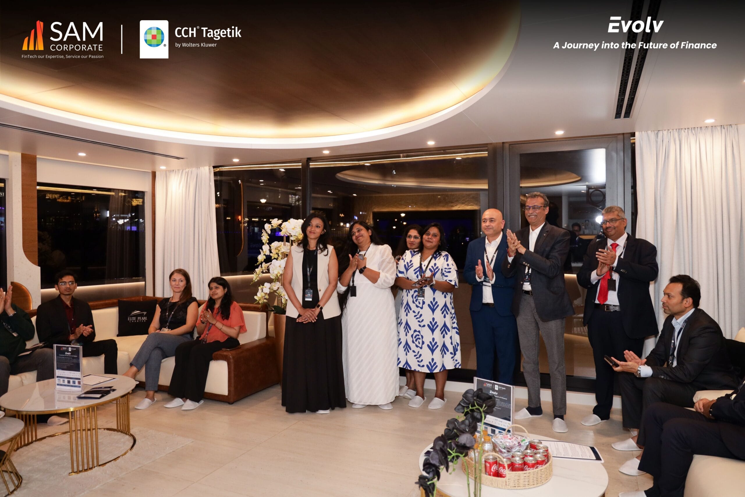 Group of finance executives applauding a speaker at the Evolv event hosted by SAM Corporate and CCH Tagetik.