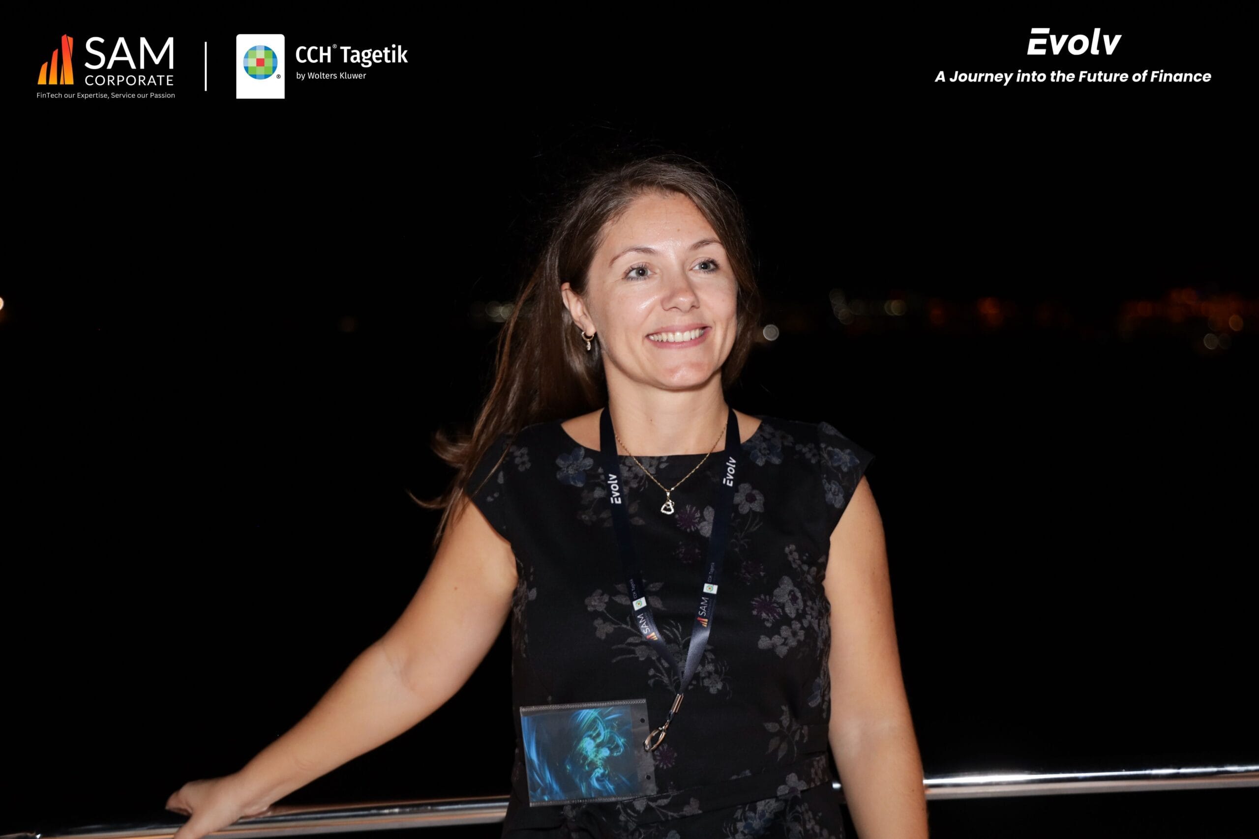 A smiling guest on the yacht deck at the Evolv networking event hosted by SAM Corporate and CCH Tagetik