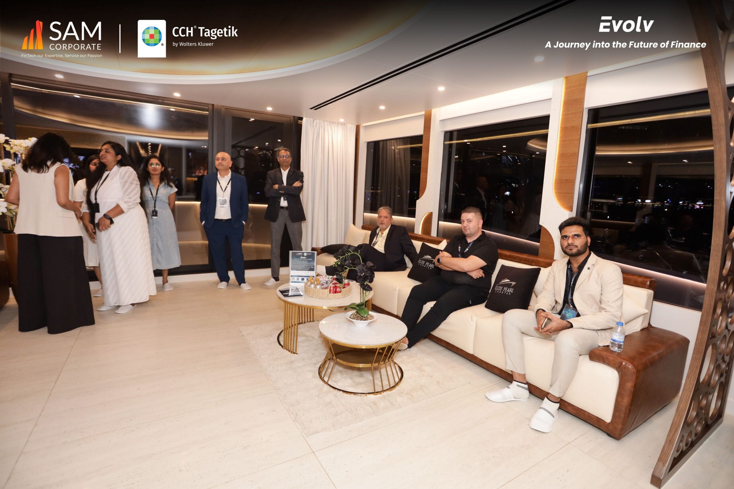 Finance executives gathering in the luxurious main lounge during the Evolv networking event by SAM Corporate and CCH Tagetik.