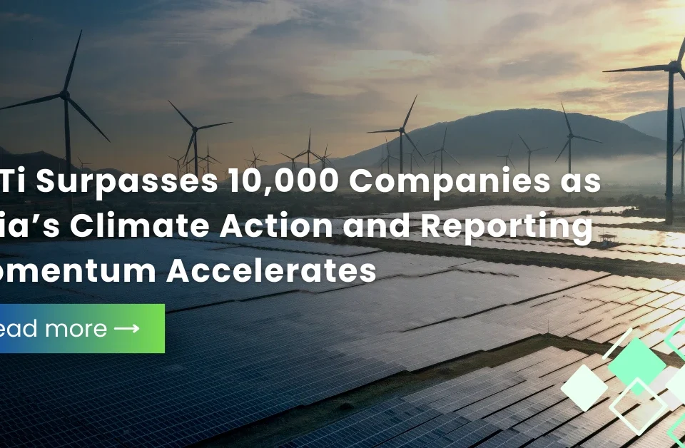 A group of professionals in an office setting celebrating the Science-Based Targets initiative (SBTi) reaching 10,000 validated companies globally as corporate climate action scales.