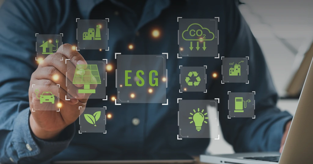 A professional interacting with a digital display of ESG icons including solar panels, recycling, and carbon reduction.